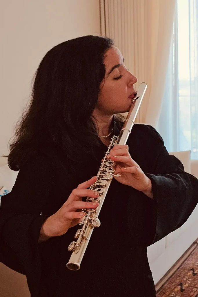 Graciela Garcia — Founder of Jumeirah Piano Studio, playing the flute